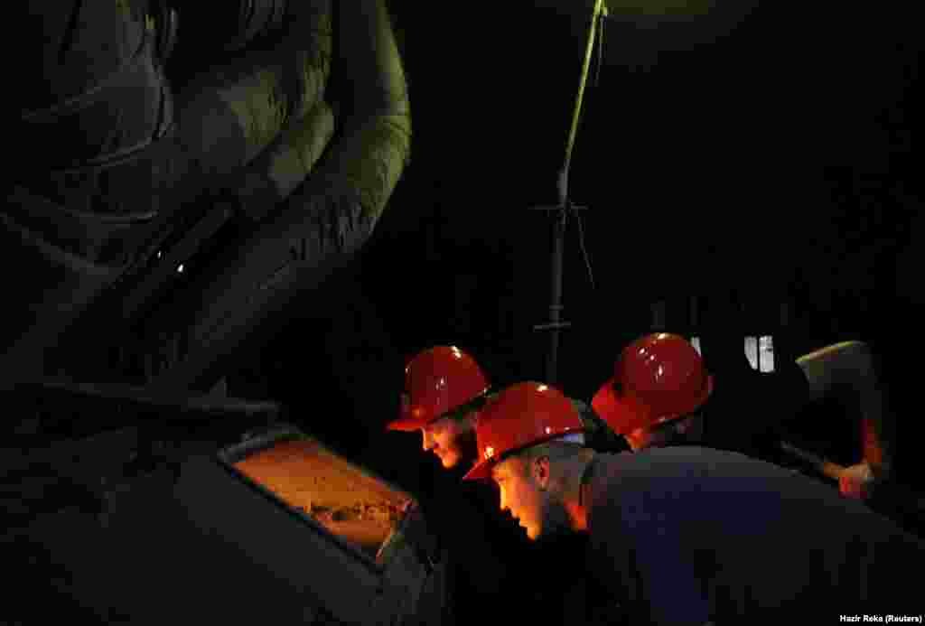 Workers are seen at the Kosovo lignite power plant and lignite mine near Shipitulle, Kosovo. (Reuters/Hazir Reka)