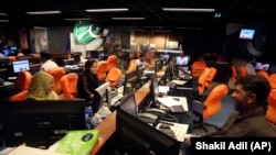 FILE: Staff of Pakistani TV station Geo News work in their control room in Karachi, April 2018