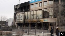 Сгоревшее здание "Озенмунайгаз" в Жанаозене, 17 декабря 2011 года.