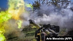 Nagorno Karabakh -- An Armenian soldier fires artillery on the front line on October 25, 2020.