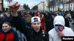 People take part in a protest rally in Maladzyechna on March 10.