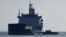 A cargo ship loaded with grain is inspected in the anchorage area of the southern entrance to the Bosphorus in Istanbulon October 31.