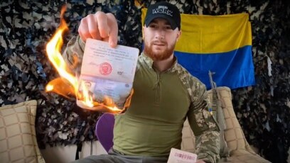 Ukrainian soldiers burn Russian flag in Vovchansk as they regain territory  