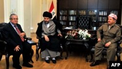 Iraqi President Jalal Talabani (left),Shi'ite cleric Moqtada al-Sadr (center), and Iraqi Kurdish leader Massud Barzani (right) at a crisis summit in Irbil on April 27. 