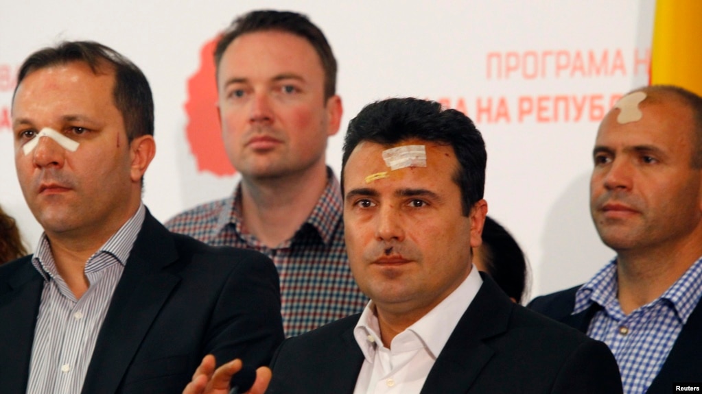Macedonian Social Democratic leader Zoran Zaev (second from right) and other members of his party injured in the April 27 violence speak to reporters in Skopje on April 28.