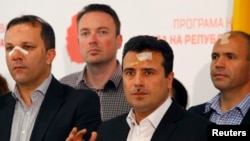 Macedonian Social Democratic leader Zoran Zaev (second from right) and other members of his party injured in the April 27 violence speak to reporters in Skopje on April 28.