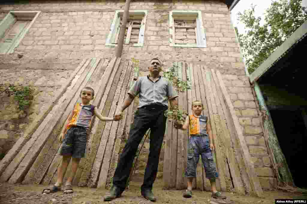 The doors and windows of the house are reinforced with concrete to protect against stray bullets.