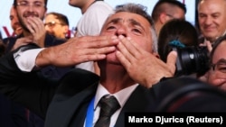 Ilija Srdanovic of the Students' List celebrates as preliminary results were announced on October 25.