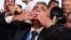 Ilija Srdanovic of the Students' List celebrates as preliminary results were announced on October 25.