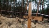 UKRAINE -- Mass burials of people and soldiers of the Armed Forces near Izyum, September 15, 2022