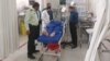 An injured victim of the knife attack in Shiraz recovers in a hospital on September 16.