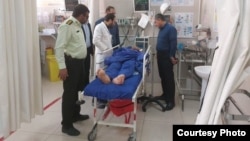 An injured victim of the knife attack in Shiraz recovers in a hospital on September 16.