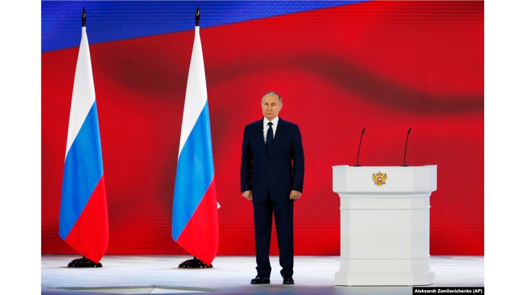 Russian President Vladimir Putin listens to the national anthem after his annual state-of-the-nation address in Moscow on April 21.