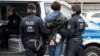 German police arrest a protester following clashes between Pro-Kurdish and Turkish demonstrators at Duesseldorf airport. 