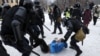 Heavily armored Russian riot police detain a young protester during an unauthorized rally in support of opposition leader Aleksei Navalny in St. Petersburg on January 31. 