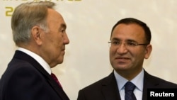 Kazakhstan -- Kazakhstan's President Nursultan Nazarbayev (L) meets Turkey's Deputy Prime Minister Bekir Bozdag during the first summit of the Cooperation Council of Turkic Speaking States (CCTS) in Almaty, 21Oct2011