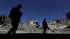 Members of Iraqi federal police patrol in the destroyed Old City of Mosul after IS fighters were driven out.