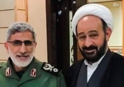 A handout photo released by Mashreghnews (a news website close to IRGC) shows new commander of IRGC's Qods Force Esmail Qaani (L) and Lebanese Shiite cleric Muhammad Kawtharani, who has long spearheaded Hezbollah's Iraq policy, undated.