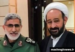 A handout photo released by Mashreghnews (a news website close to IRGC) shows new commander of IRGC's Qods Force Esmail Qaani (L) and Lebanese Shiite cleric Muhammad Kawtharani, who has long spearheaded Hezbollah's Iraq policy, undated.