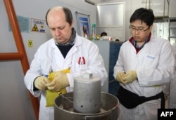 IAEA officials carry out an inspection at Iran's Natanz nuclear power plant in 2014.