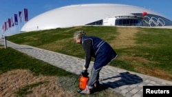 Days before the Winter Olympics open on February 7, many facilities in the Russian host city of Sochi remain unfinished. Workers are under pressure to clear construction rubble, pave streets, and even hydroseed yellowing grass before the games begin.