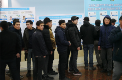 A polling station in Tashkent was quiet until this group of men arrived.