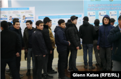 A polling station in Tashkent was quiet until this group of men arrived.