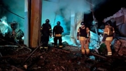 Rescuers work at the site of a Russian missile strike in Kryviy Rih, Ukraine, on February 23.