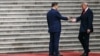 US President Donald Trump (right) shakes hands with Chinese leader Xi Jinping at a welcome ceremony in Beijing on May 14.