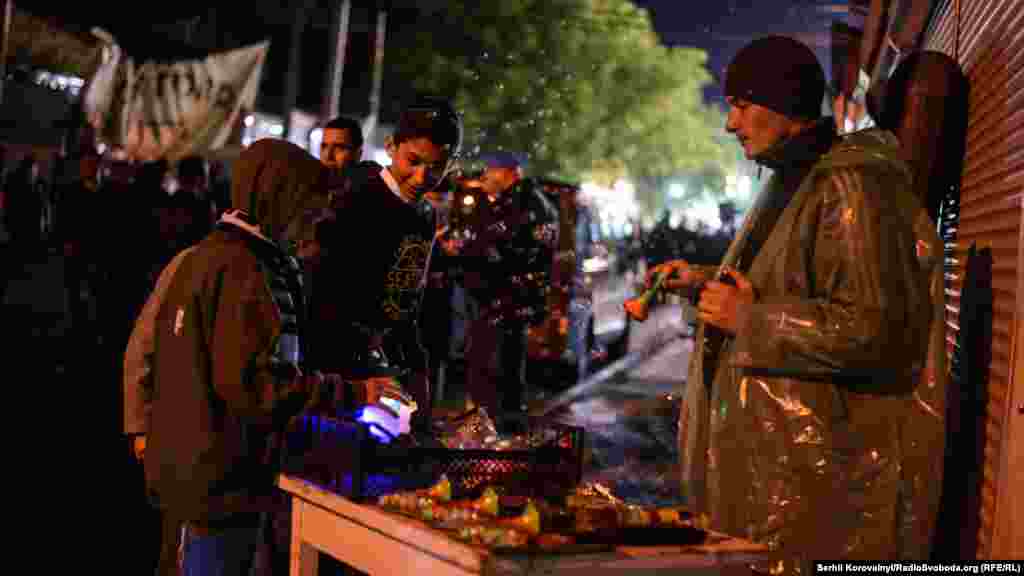 Local residents sell trinkets to pilgrims.