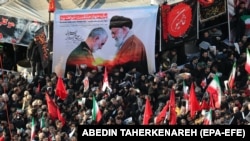 Thousands of Iranians on January 6 attend the funeral of Quds Force commander Qasem Soleimani, who was killed by a U.S. air strike. 