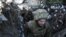 Украински войници в укрепление близо до окупираните от проруски сепаратисти зони в източна Украйна. Февруари, 2021 г.