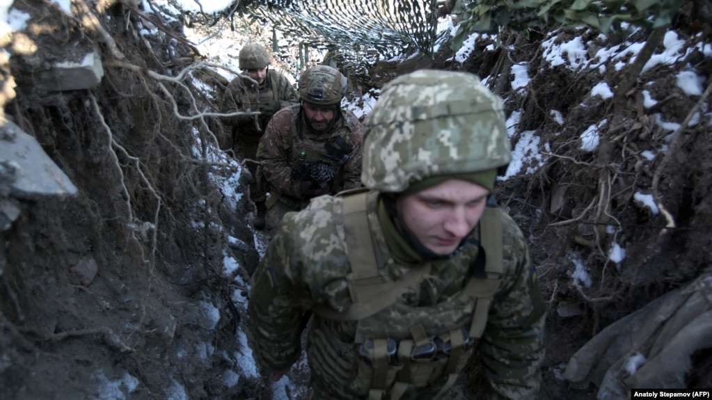 Ukrainian servicemen take up positions on the front line with Russia-backed separatists in the eastern Donetsk region last month.