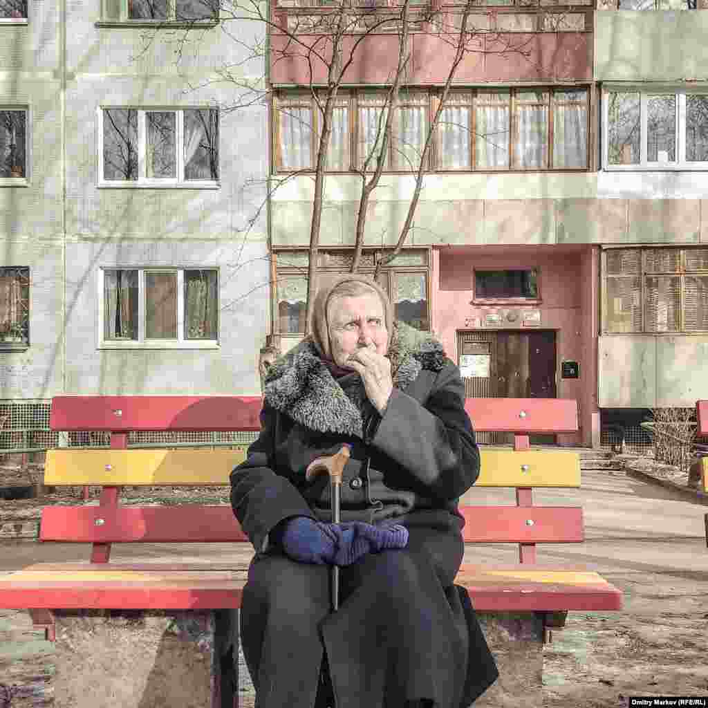 An elderly woman soaking up the sunshine