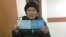 Kazakhstan - Sairagul Sauytbai shows her new document which gives her right to stay in Kazakhstan for another 3 months. Almaty, 28January2019