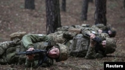 Young recruits of the Ukrainian Armed Forces attend a basic combat training course in Kharkiv region.
