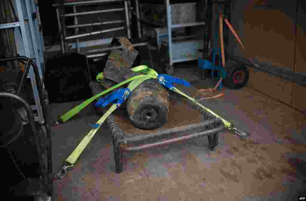A World War II bomb was found alongside the railway line near Berlin's central railway station. The discovery of the unexploded 100-kilogram bomb snarled rail and road traffic in the German capital until it was defused. (AFP/Johannes Eisele)