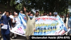Afghans protest against the Iranian regime and demand justice for Afghans allegedly killed by the Iranian security forces, in Jalalabad, on June 8.