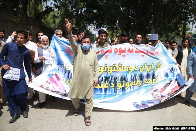 Afghans rally in Jalalabad on June 8 to demand justice for the migrants allegedly killed by Iranian security forces.