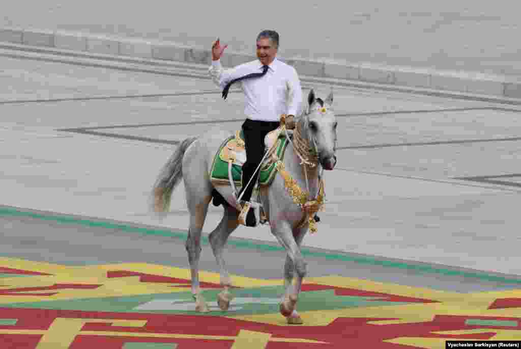 Turkmen President Gurbanguly Berdymukhammedov rides a horse in a parade marking Independence Day in Ashgabat on September 27.