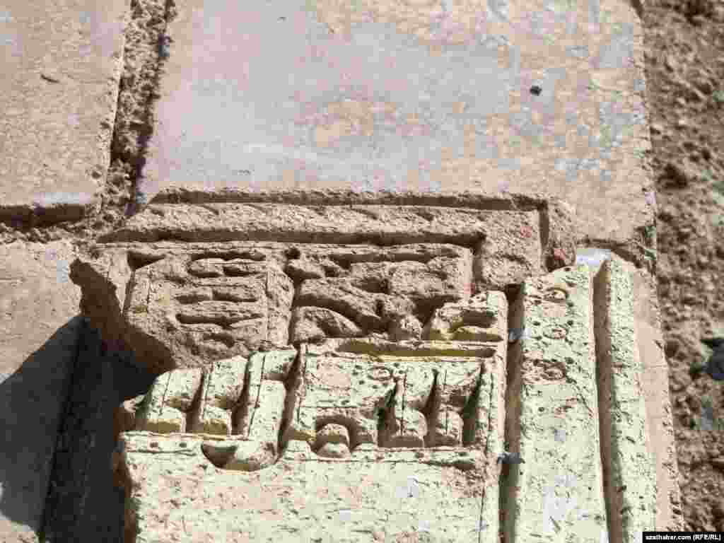 Turkmenistan. Falleln piece of stone of Mausoleum of Mane Baba. Kahka. November 17, 2013