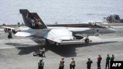 An F/A-18E Super Hornet on the flight deck of the aircraft carrier USS Nimitz