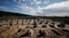 FILE PHOTO: A view of new graves for people killed during Russia's invasion of Ukraine, at a cemetery in Bucha