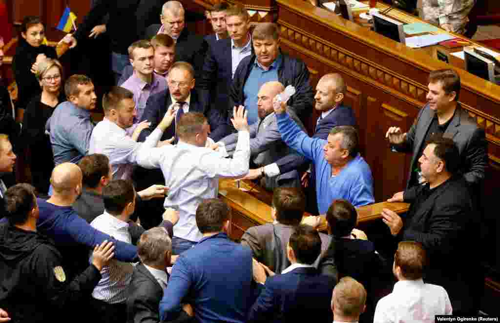 A scuffle breaks out in the Ukrainian parliament on October 6, 2017. The melee erupted over a law regarding Ukraine's state sovereignty in separatist-held territory in the east of the country.