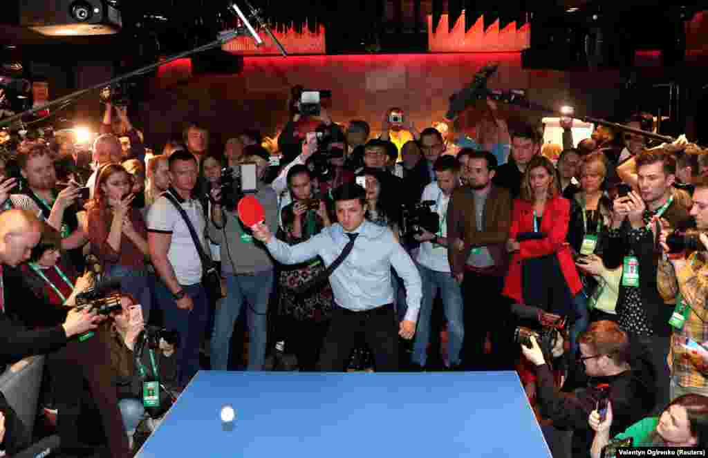 Ukrainian comic actor and presidential candidate Volodymyr Zelenskiy plays table tennis on March 31 as he visits his campaign headquarters following a presidential election in Kyiv, Ukraine. Zelenskiy was subsequently inaugurated as president in May after winning comfortably over the incumbent, Petro Poroshenko. (Reuters/Valentyn Ogirenko)