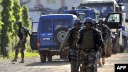 Malian troops take position near the Radisson Blu hotel in Bamako on November 20.