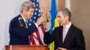 U.S. Secretary of State John Kerry (left) toasts a glass of wine with Moldovan Prime Minister Iurie Leanca at the Cricova winery, near Chisinau, during his December 4 visit.
