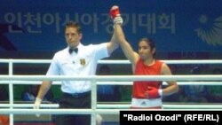 Tajik boxer Mavzuna Chorieva is shown after a victory in the Asian Games in South Korea in 2014.