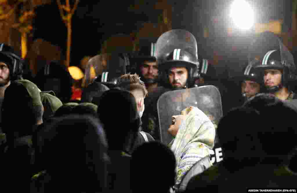 An Iranian woman mourns a victim of the blast.