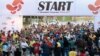 File - Participants attend the first international Tehran marathon at Azadi Square in Tehran, April 7, 2017